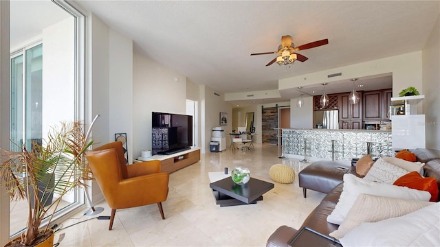 living area with a ceiling fan