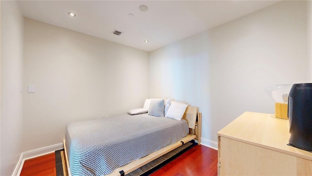 bedroom with recessed lighting, baseboards, dark wood finished floors, and visible vents