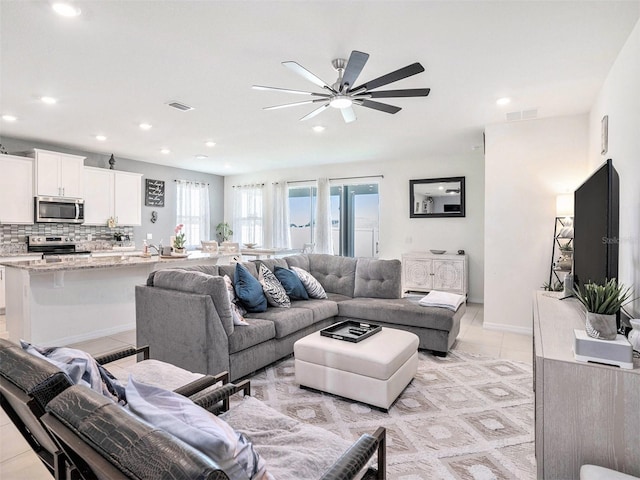 5464 Flint Hills Dr, Wimauma, FL 33598 - living room with a ceiling fan, recessed lighting, light tile patterned flooring, and visible vents