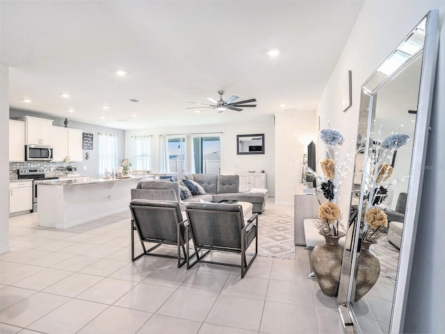 5464 Flint Hills Dr, Wimauma, FL 33598 - living room featuring a ceiling fan, recessed lighting, and light tile patterned floors