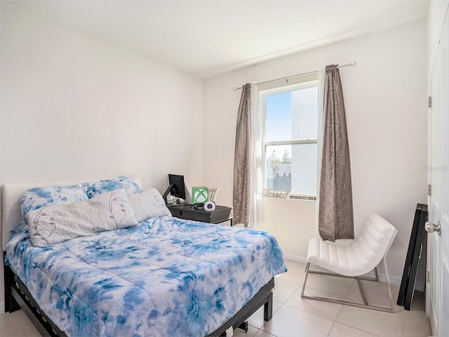 5464 Flint Hills Dr, Wimauma, FL 33598 - tiled bedroom with baseboards
