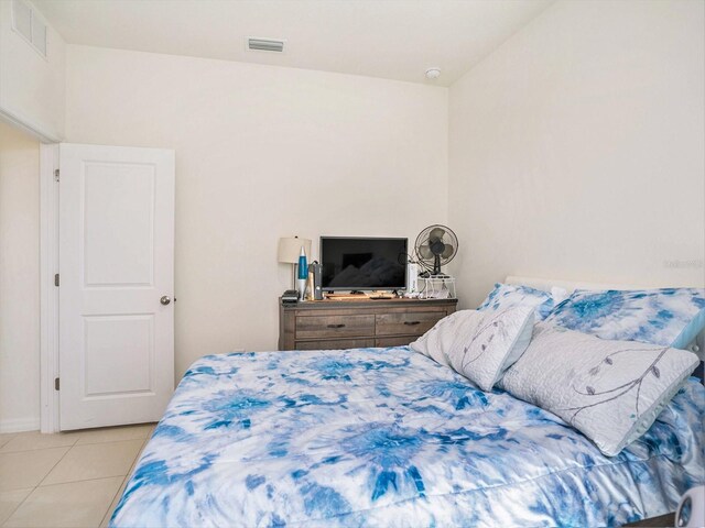 5464 Flint Hills Dr, Wimauma, FL 33598 - bedroom with baseboards, visible vents, and light tile patterned floors