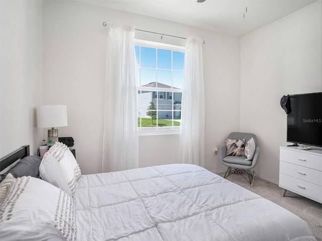 5464 Flint Hills Dr, Wimauma, FL 33598 - carpeted bedroom featuring baseboards