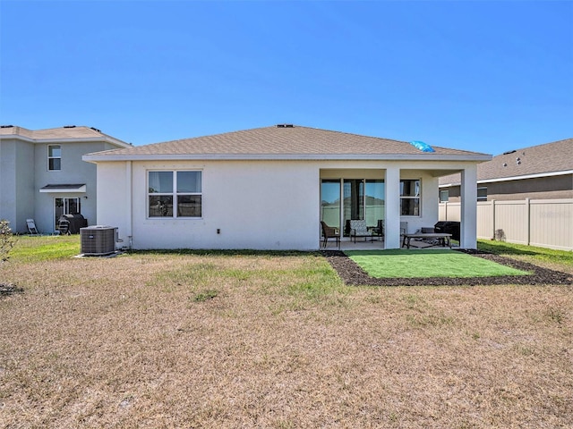 5464 Flint Hills Dr, Wimauma, FL 33598 - back of house featuring stucco siding, fence, a patio, and cooling unit