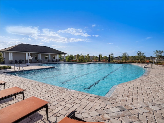 5464 Flint Hills Dr, Wimauma, FL 33598 - community pool with a patio area