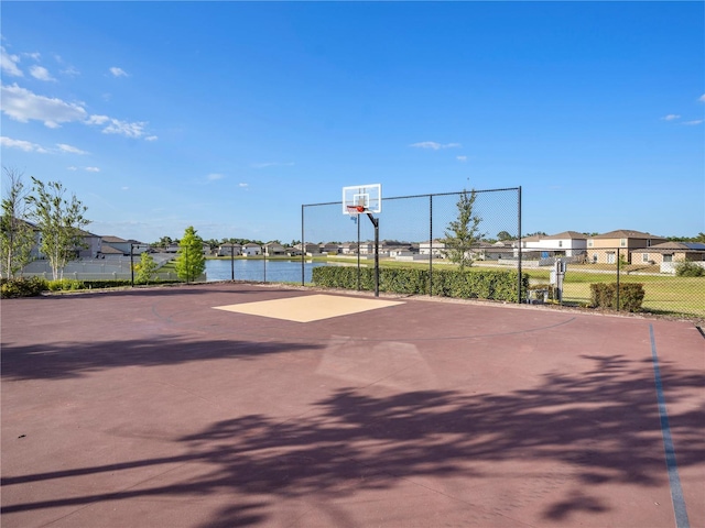 5464 Flint Hills Dr, Wimauma, FL 33598 - view of sport court with fence, community basketball court, and a residential view