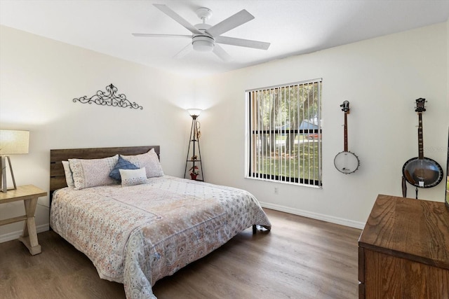 7120 N Croton Pt, Hernando, FL 34442 - bedroom with baseboards, a ceiling fan, and wood finished floors