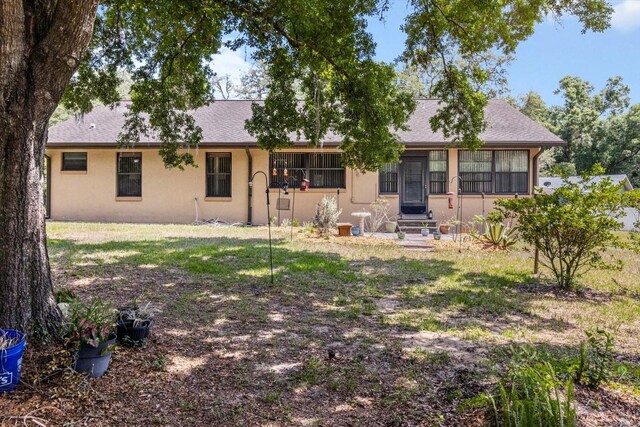 7120 N Croton Pt, Hernando, FL 34442 - rear view of house featuring stucco siding and entry steps