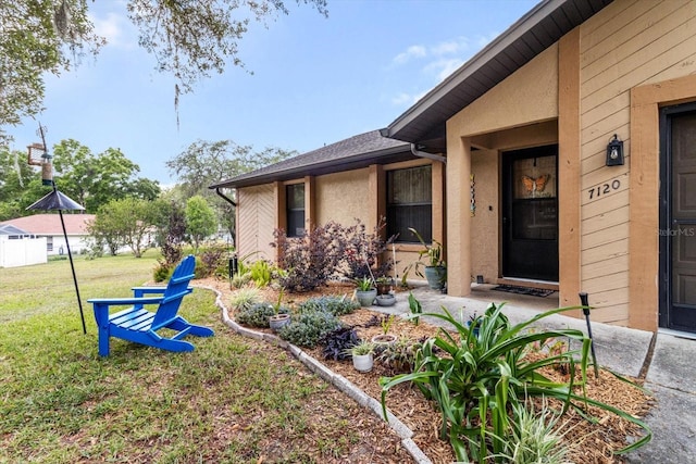 7120 N Croton Pt, Hernando, FL 34442 - property entrance featuring a lawn and stucco siding