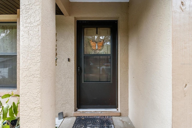 7120 N Croton Pt, Hernando, FL 34442 - doorway to property featuring stucco siding
