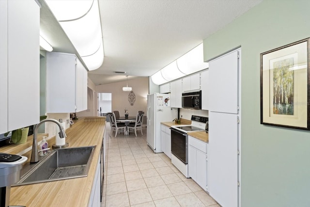 7120 N Croton Pt, Hernando, FL 34442 - kitchen with white cabinets, light tile patterned flooring, a sink, white appliances, and wooden counters