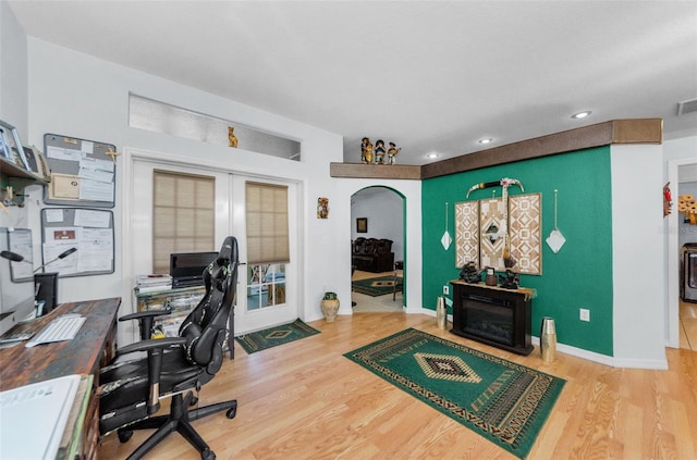 12923 Colony Rd, Hudson, FL 34669 - office space featuring arched walkways, french doors, recessed lighting, wood finished floors, and visible vents