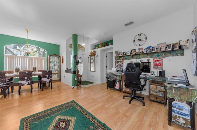 12923 Colony Rd, Hudson, FL 34669 - office featuring a notable chandelier, wood finished floors, and visible vents
