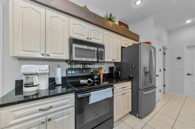 12923 Colony Rd, Hudson, FL 34669 - kitchen with light tile patterned floors, recessed lighting, stainless steel appliances, and dark stone countertops
