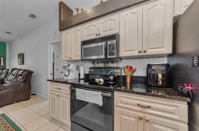 12923 Colony Rd, Hudson, FL 34669 - kitchen with visible vents, open floor plan, stainless steel microwave, and black electric range oven