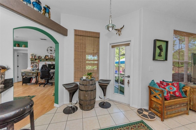 12923 Colony Rd, Hudson, FL 34669 - dining room featuring arched walkways and tile patterned floors