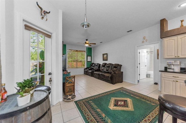 12923 Colony Rd, Hudson, FL 34669 - living room with ceiling fan, a wealth of natural light, light tile patterned flooring, and visible vents
