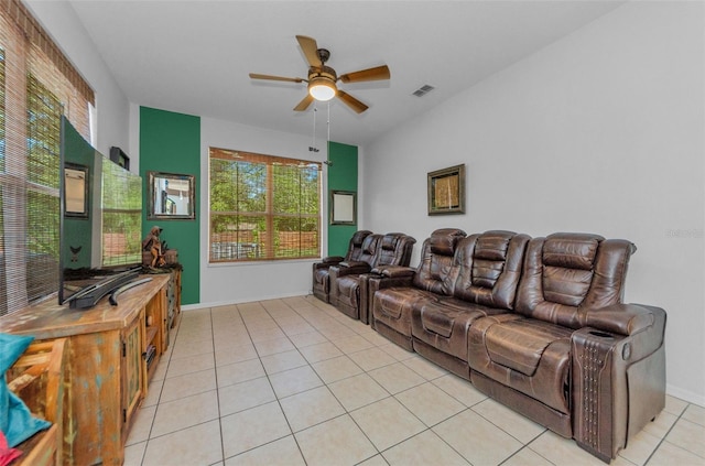 12923 Colony Rd, Hudson, FL 34669 - living area with light tile patterned floors, ceiling fan, plenty of natural light, and visible vents