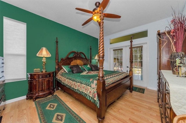 12923 Colony Rd, Hudson, FL 34669 - bedroom with access to outside, baseboards, ceiling fan, and wood finished floors