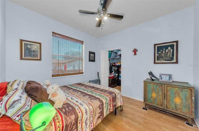 12923 Colony Rd, Hudson, FL 34669 - bedroom featuring a ceiling fan, a closet, wood finished floors, and a spacious closet