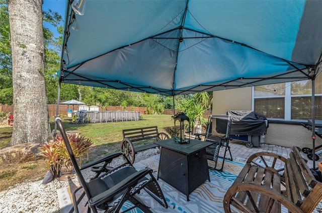 12923 Colony Rd, Hudson, FL 34669 - wooden terrace with a fenced backyard, a yard, and a grill