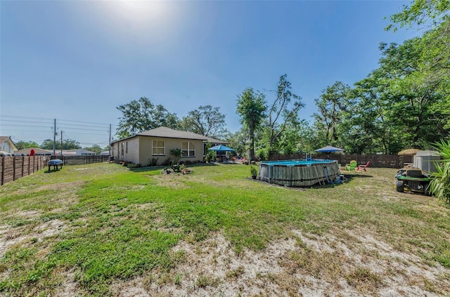 12923 Colony Rd, Hudson, FL 34669 - view of yard featuring a fenced in pool and a fenced backyard