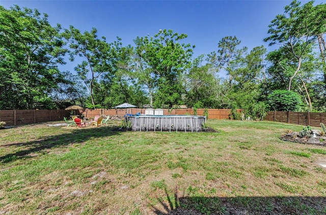 12923 Colony Rd, Hudson, FL 34669 - view of yard featuring a fenced backyard and a fenced in pool
