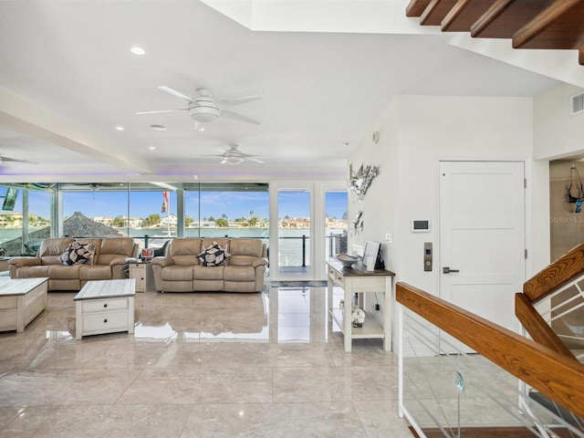 living room featuring visible vents, a ceiling fan, and marble finish floor