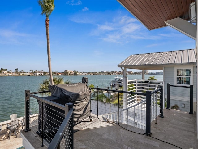 view of dock featuring a water view and a balcony