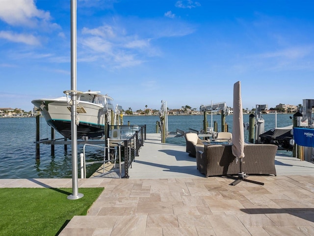 view of dock with boat lift and a water view