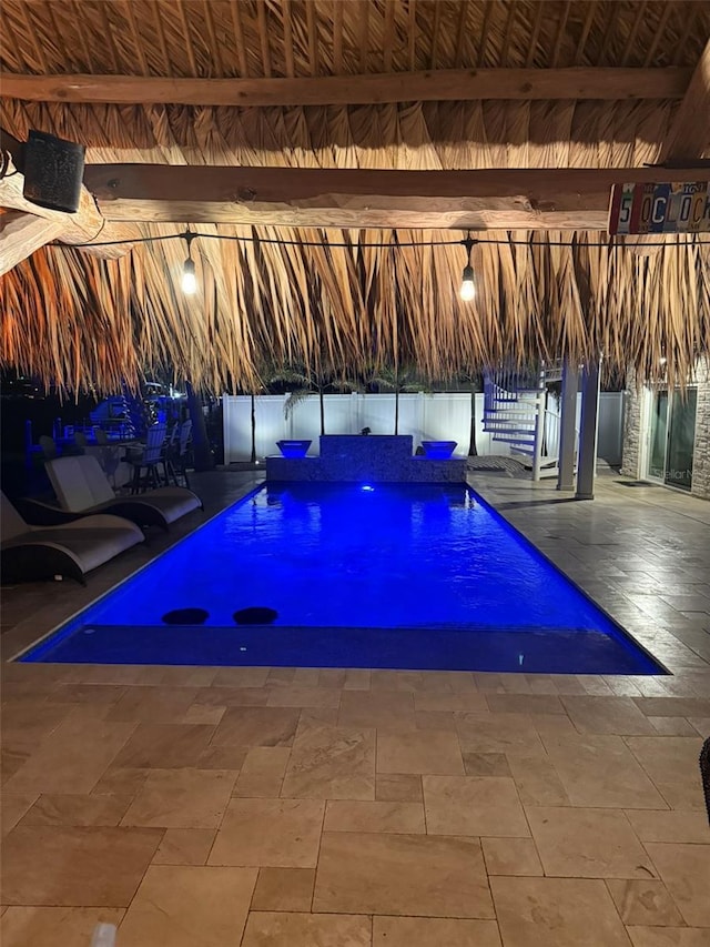 view of swimming pool featuring a fenced in pool, a patio area, and fence