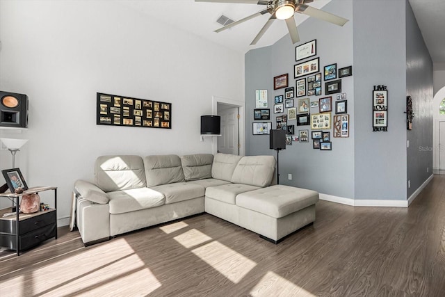 living room with high vaulted ceiling, a ceiling fan, wood finished floors, and visible vents
