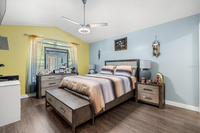 bedroom featuring a ceiling fan, baseboards, dark wood finished floors, and lofted ceiling