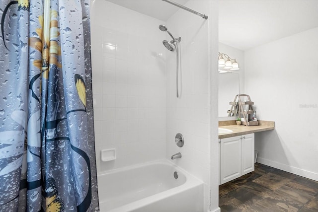 bathroom featuring vanity, shower / tub combo with curtain, and baseboards