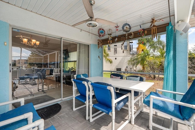 view of patio / terrace with outdoor dining area and a ceiling fan