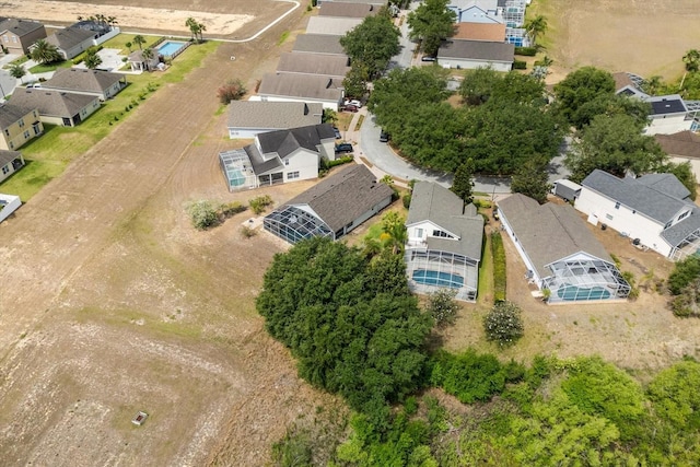 birds eye view of property with a residential view