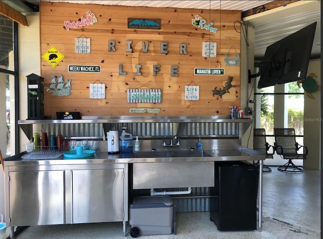 bar with wooden walls and speckled floor