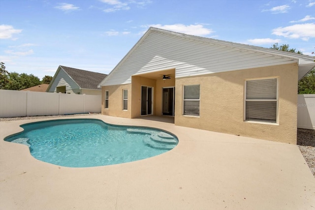 view of pool with a fenced in pool, fence, and a patio