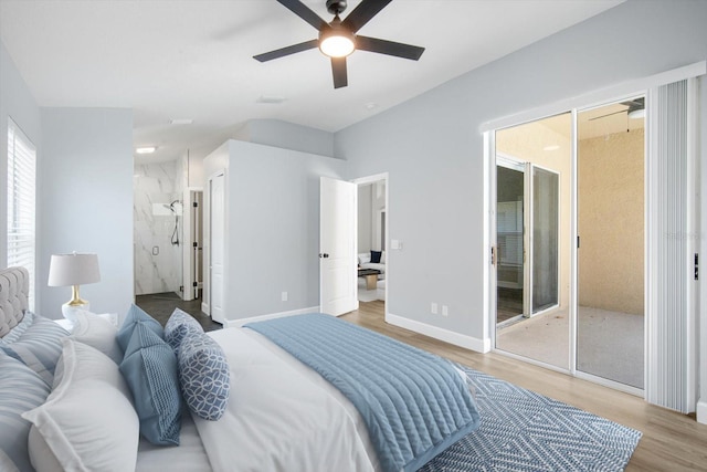 bedroom with baseboards, a ceiling fan, light wood-type flooring, and ensuite bath