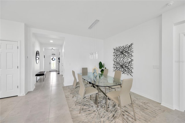 dining room with recessed lighting, baseboards, and light tile patterned flooring