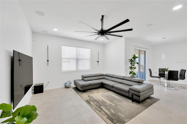 living room featuring baseboards, recessed lighting, ceiling fan, and light tile patterned floors