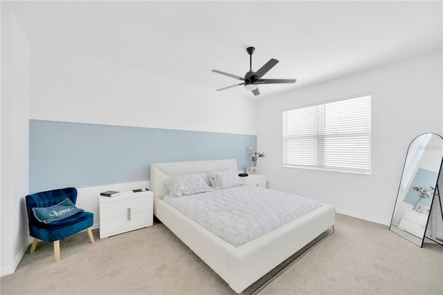 bedroom featuring carpet floors, baseboards, and a ceiling fan