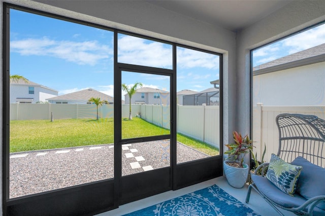 sunroom / solarium with a residential view