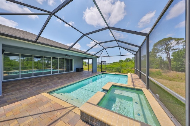 view of swimming pool featuring a patio, ceiling fan, and a pool with connected hot tub