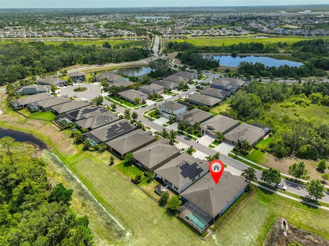 aerial view featuring a water view and a residential view
