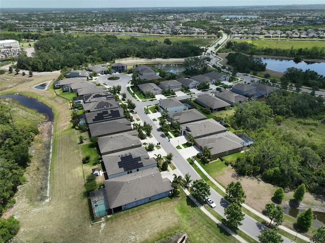 bird's eye view with a residential view and a water view