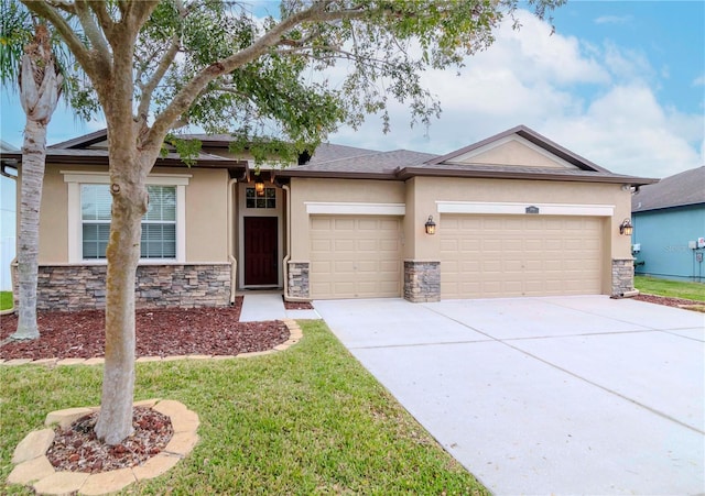 single story home featuring stucco siding, a garage, stone siding, concrete driveway, and a front yard