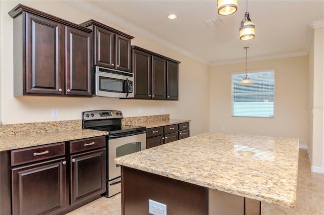kitchen with appliances with stainless steel finishes, crown molding, dark brown cabinetry, decorative light fixtures, and a center island