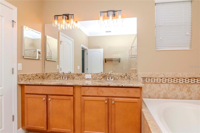 bathroom featuring a bath, a shower, double vanity, and a chandelier