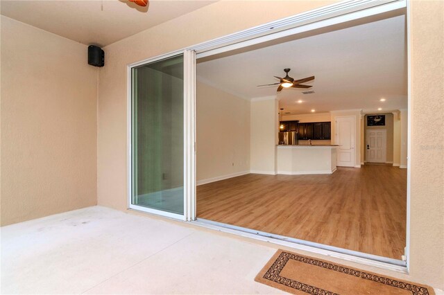 view of patio / terrace featuring ceiling fan